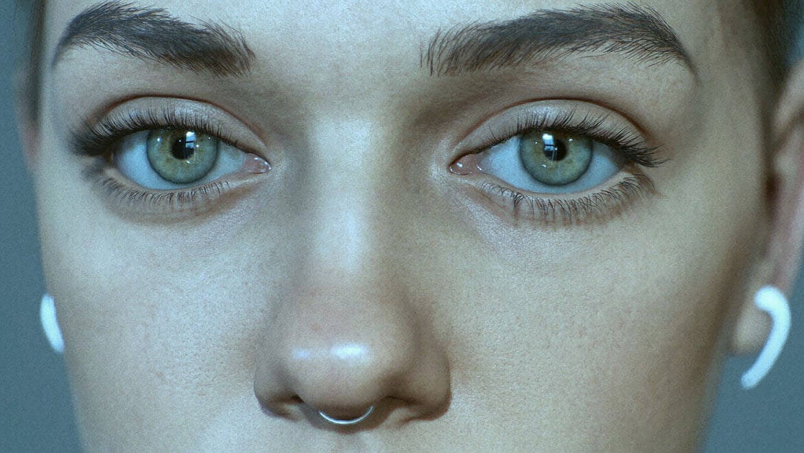 Portrait of young woman with nose ring and green eyes