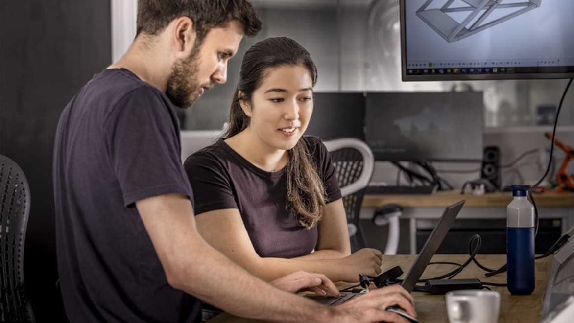 Two people using Fusion 360 for 3d printing