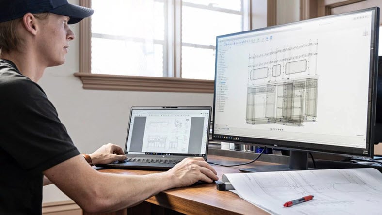 Man using drawings in Autodesk Fusion