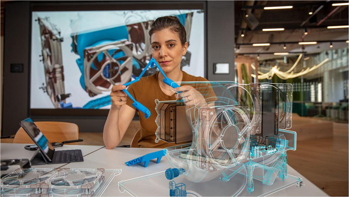 Woman using Autodesk Fusion for Design for running generative design studies.