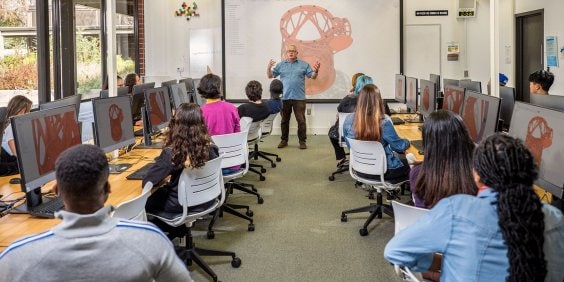CAD Educator in front of students in computer lab