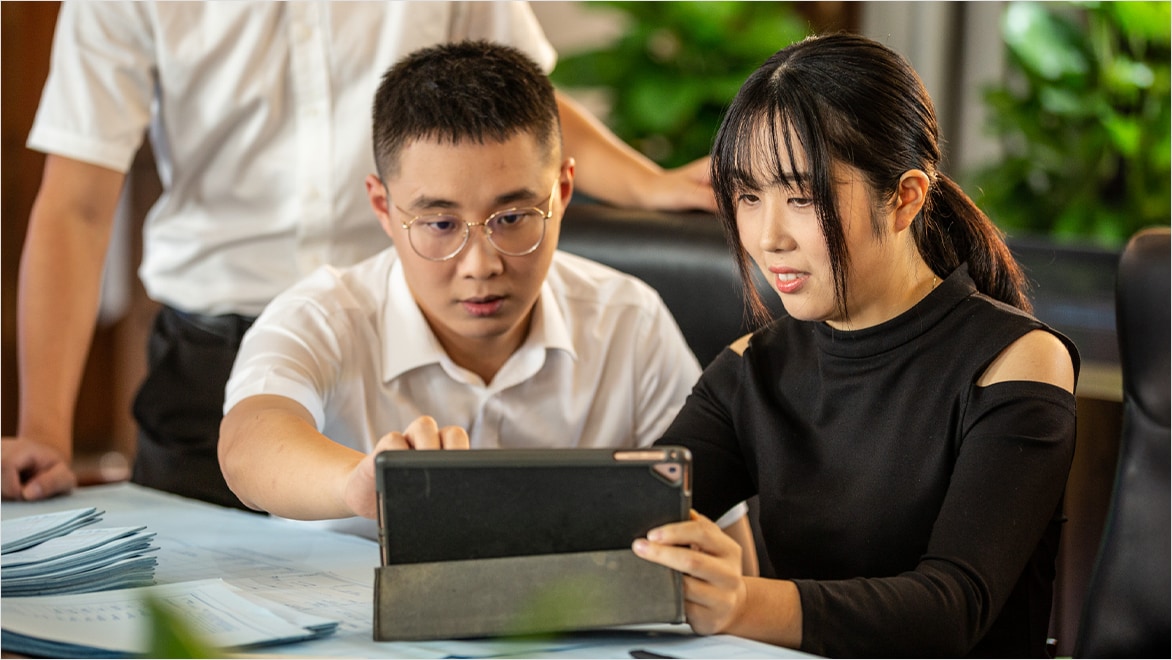 Two colleagues working on server