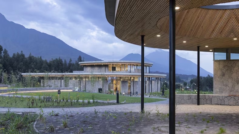 Front view of Dian Fossey gorilla fund campus with mountains in background.