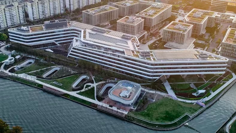 Open space with timber columns and wall-to-ceiling windowsAerial view of Johnson Control's new Asia-Pacific headquarters.