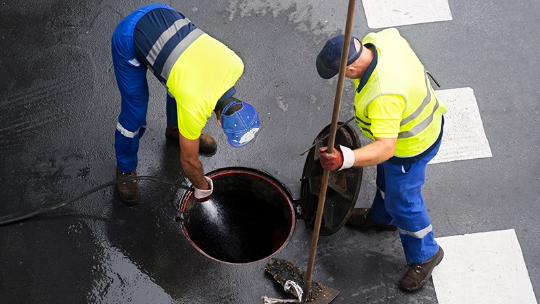 Men working on a manhole