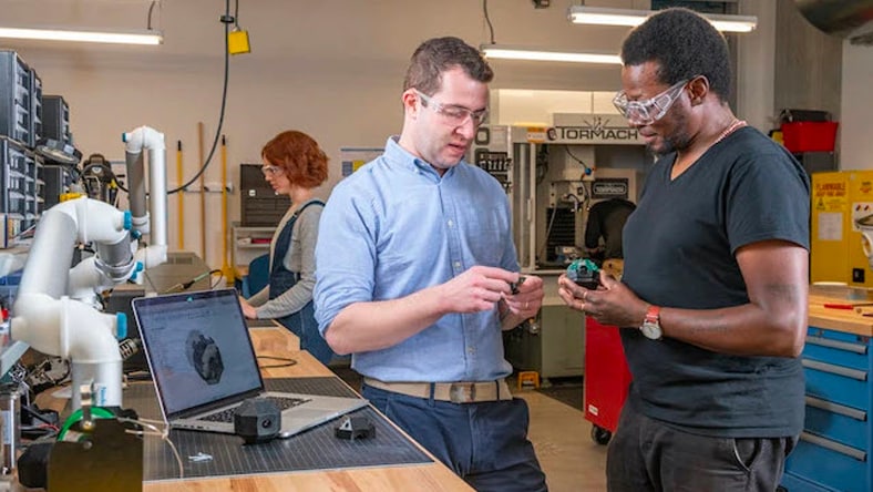 Engineers interacting with consumer electronics product
