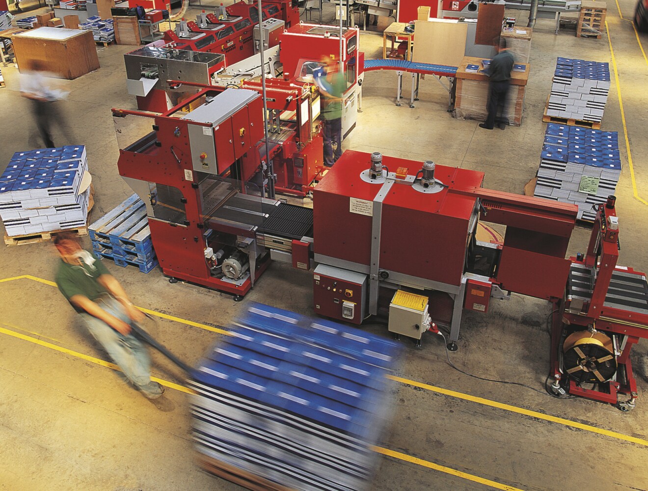 Image showing a manufacturing floor with workers moving inventory.
