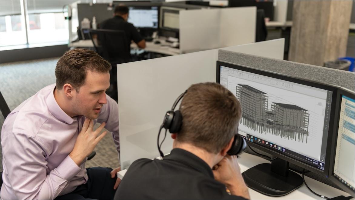 Employees of Glumac, a design and engineering firm that specializes in green building design, run simulations on a planned building.