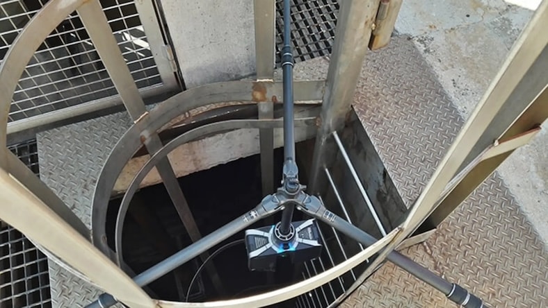 A view of a remote control reality capture camera at the top of a sewer at a nuclear power plant.