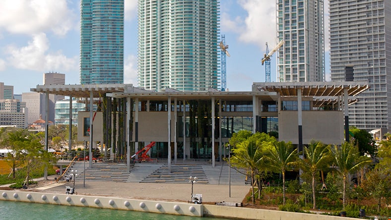 The Perez Art museum sits in front of the Miami skyline.