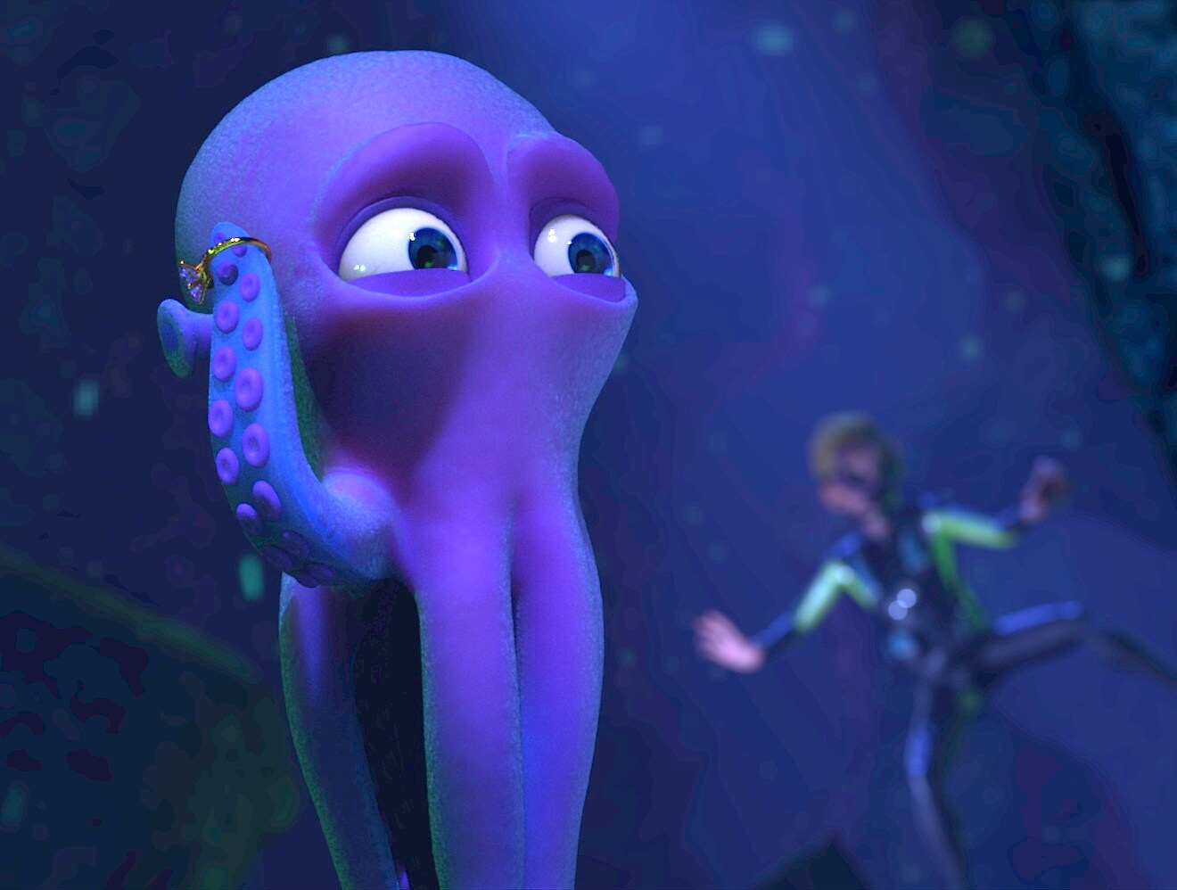 A cartoon-style character model of an octopus with a human diver in the background.
