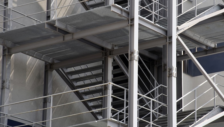 A detailed photo of a building fire escape illustrates cold-formed steel’s strength.