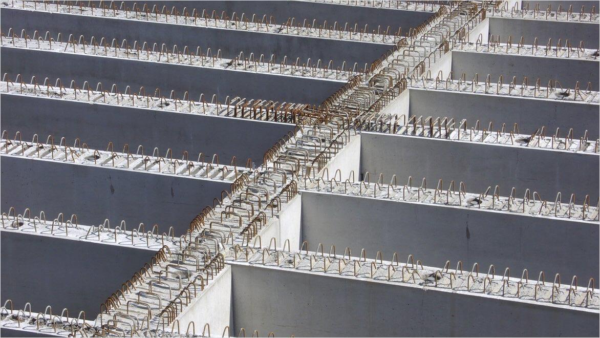 Reinforced concrete foundation at a construction site.