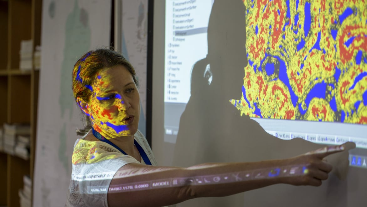 Stakeholder engages in master planning discussion, using 3D analysis to discuss sustainable land use and community impact.