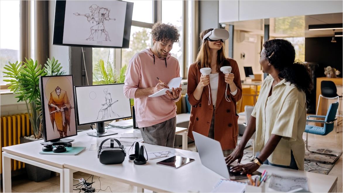 A group of gaming VR developers test software in an office.