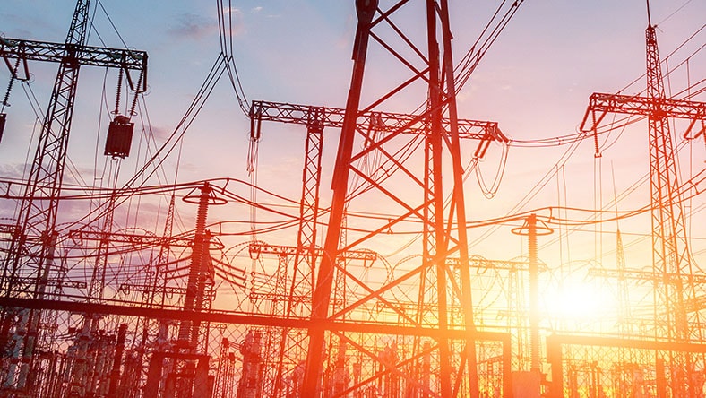 An image of an electric substation at sunset.