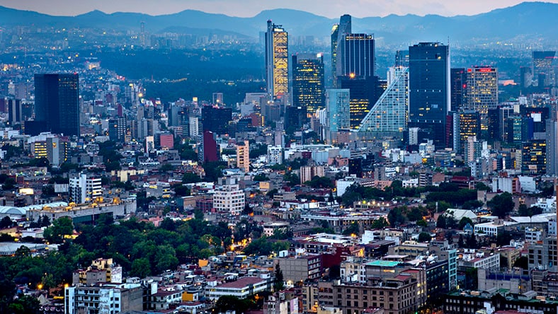 An image of the Mexico City skyline at dusk.