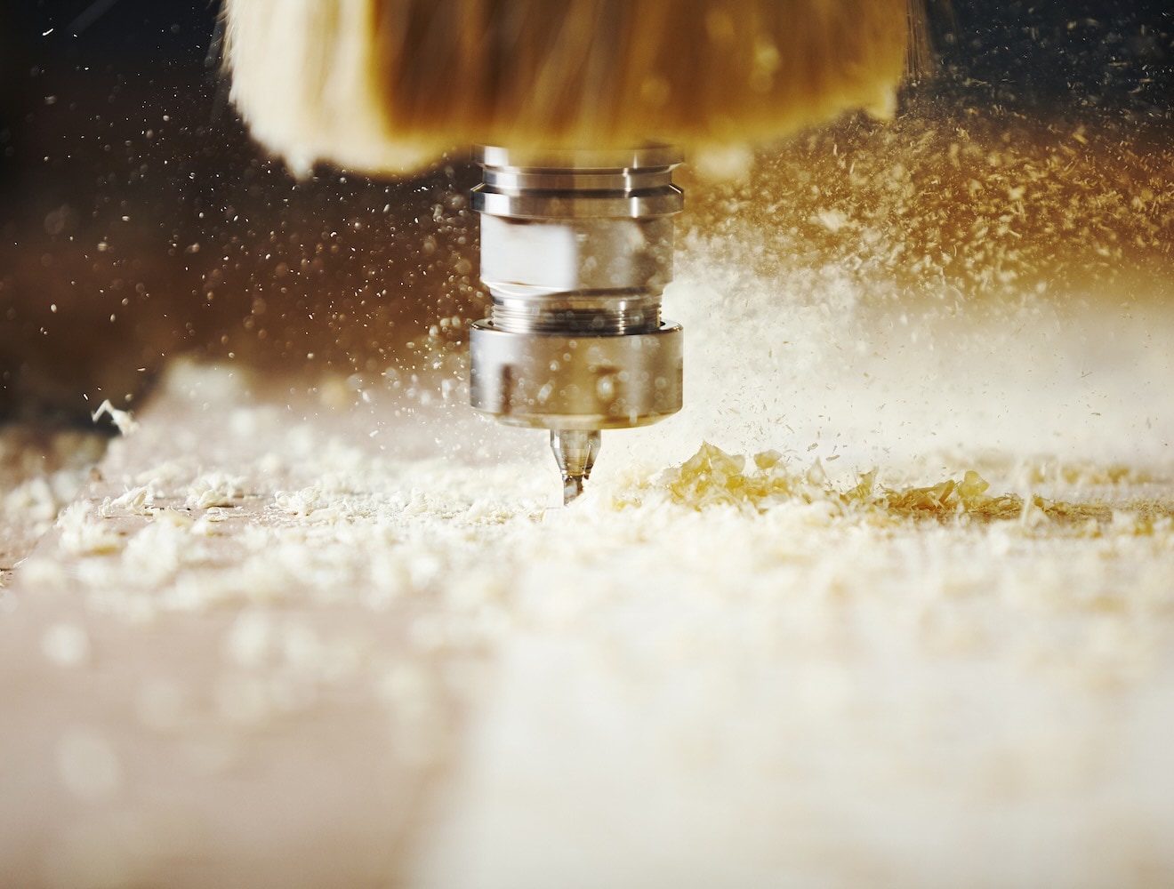 1156645766 Close-up of a CNC router cutting wood.