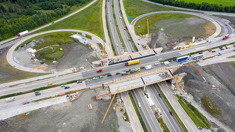 1404499206 An aerial view shows the reconstruction of a highway interchange.