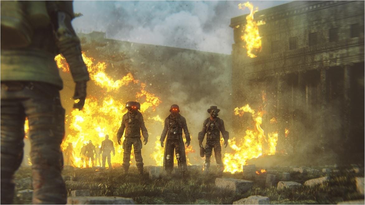 Video game mercenaries stand before burning buildings in a post-apocalyptic setting.