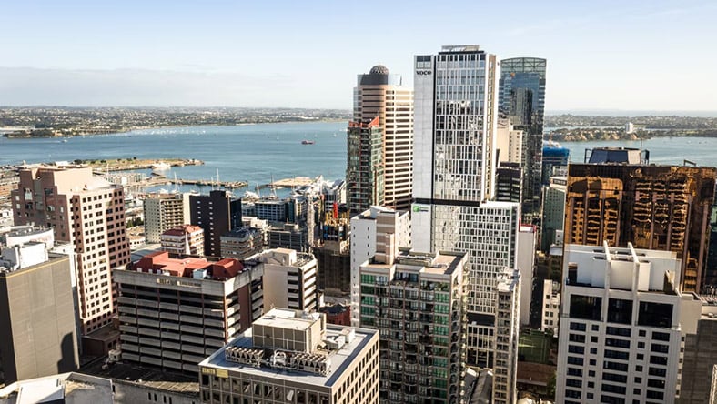 A rendering shows the voco Hotel against Auckland's skyline.