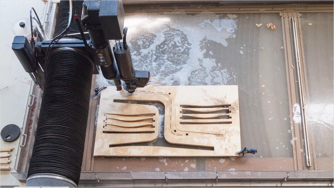 Custom manufacturing protoyping water jet machine cutting out chair components