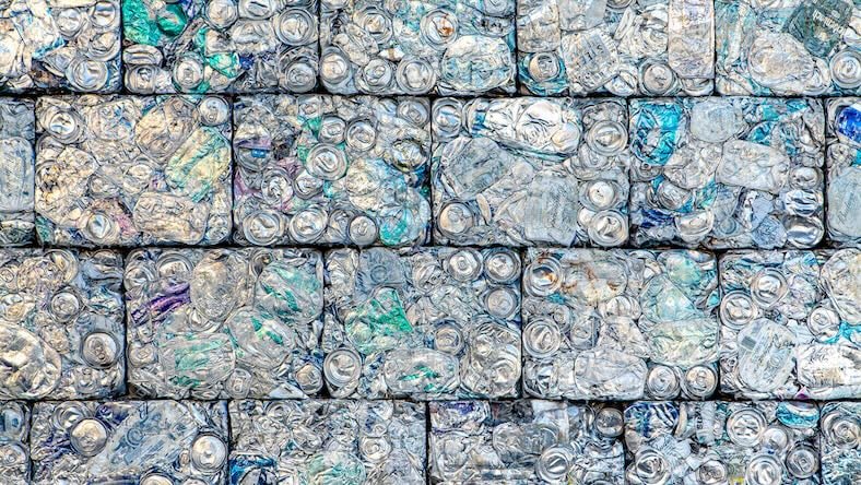 Recycled aluminum cans crushed into bricks for modular building.