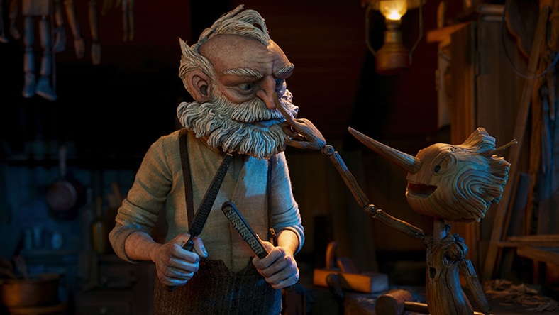 A wooden Pinocchio points to his maker, Geppetto.