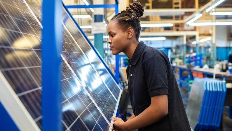 industrial engineering sustainability worker in solar panel factory