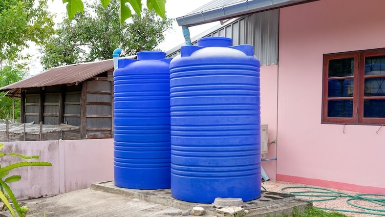 A rainwater collection system attached to a home.