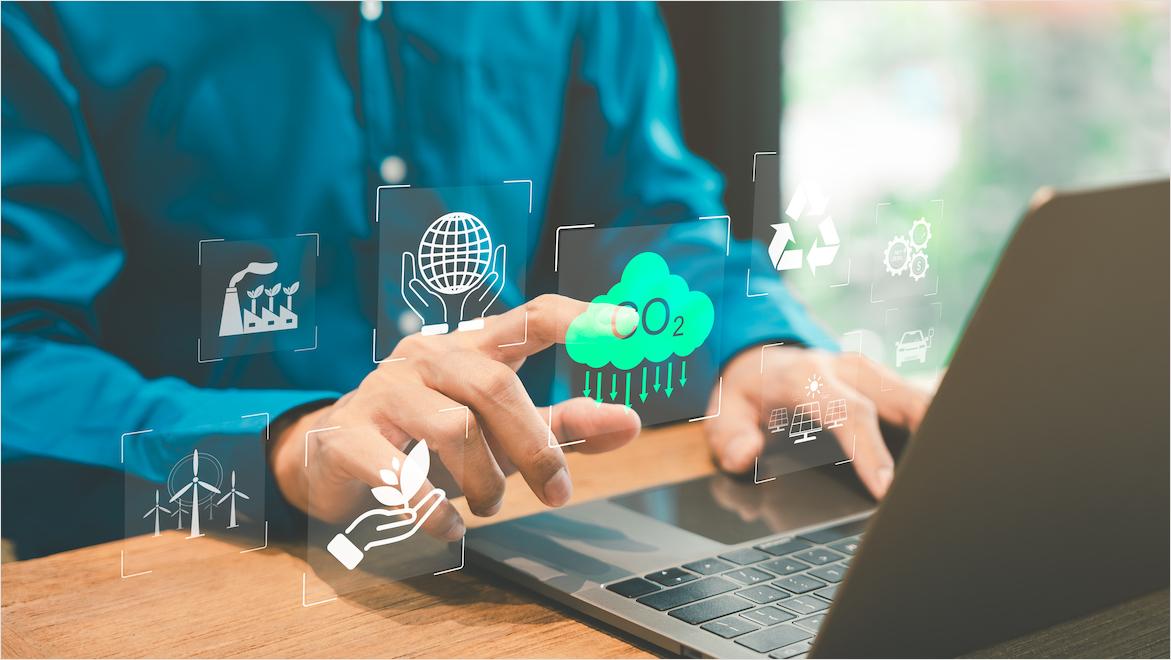 A man uses a laptop with superimposed icons representing sustainability, CO2 emissions, and environmental management strategies.