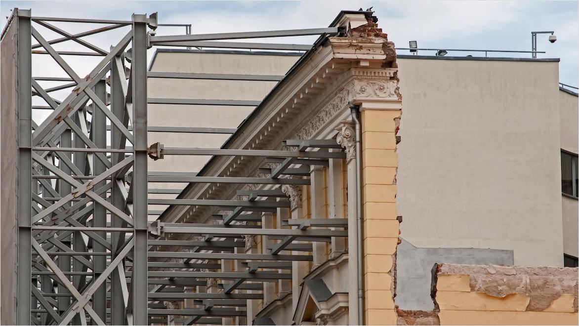 A building is reinforced with steel beams as part of a retrofit.