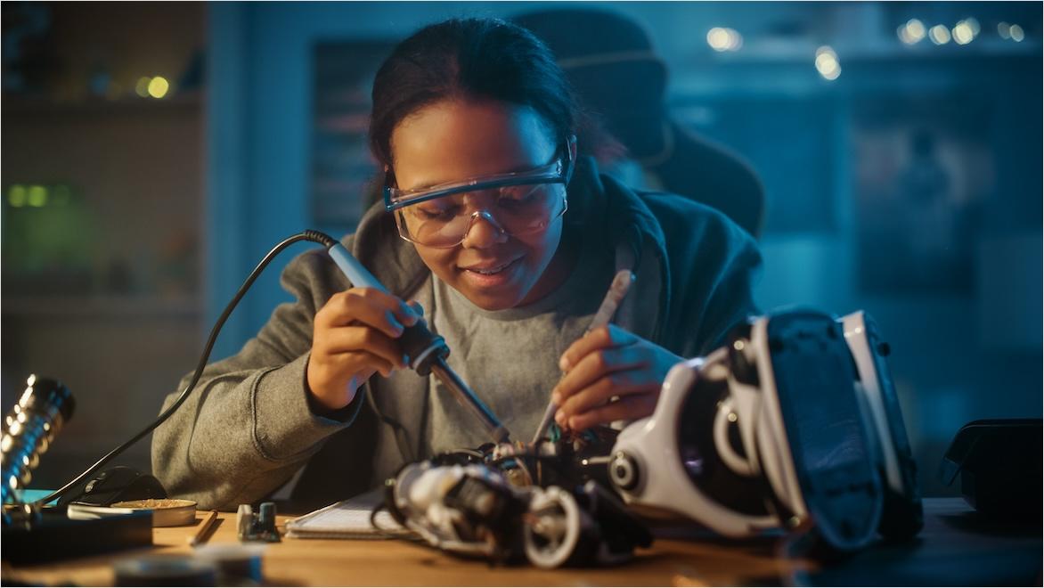 A student works on a robotics project.