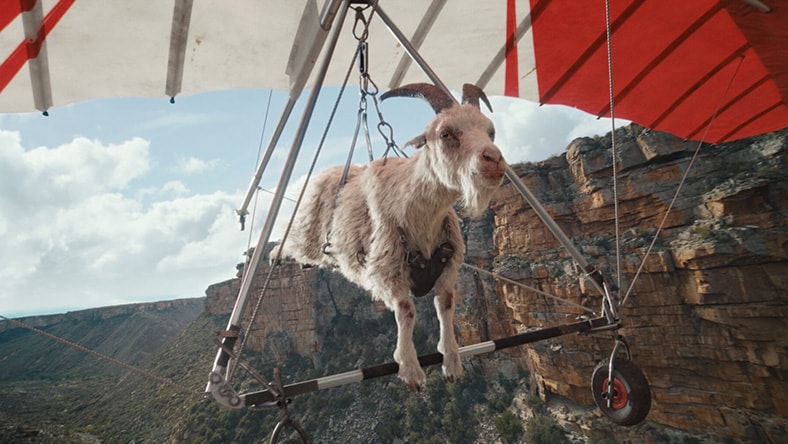 A computer-generated goat is skydiving.