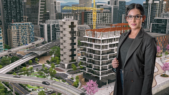 Woman standing in the foreground of cityscape model