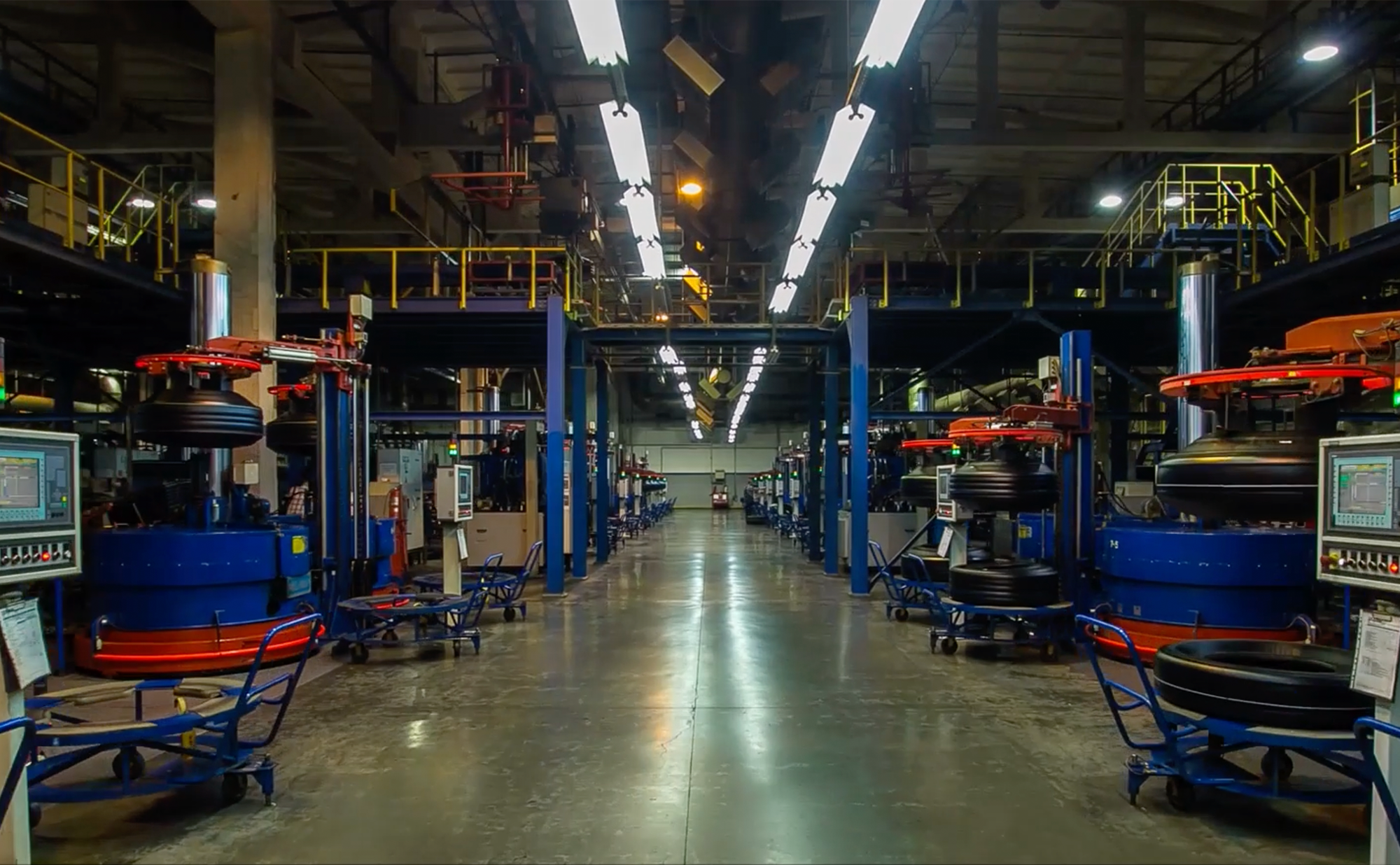 Worker picking up parts from a tray