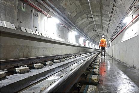 Worker with hard hat in a subway tunnel
