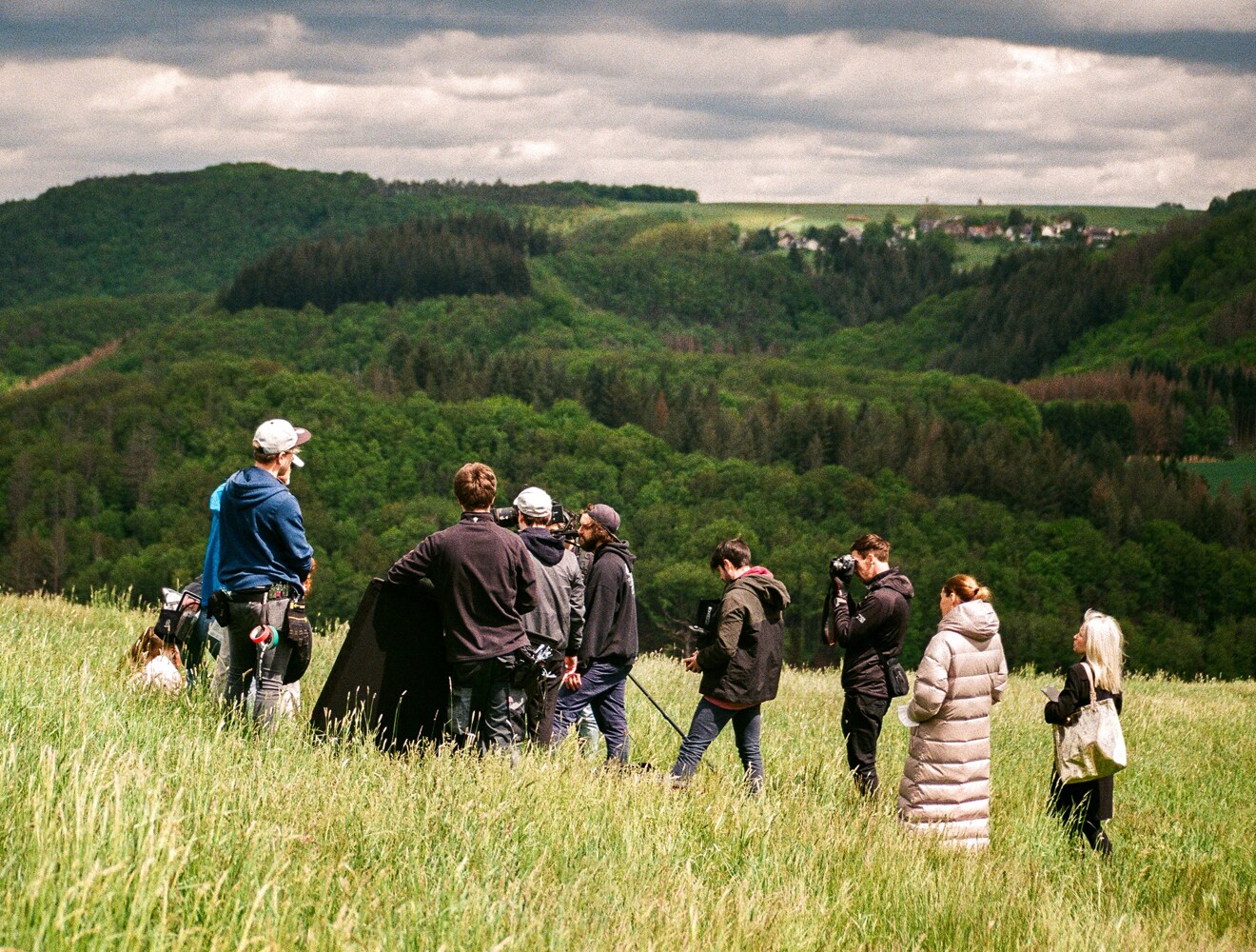 Camera crew filming on location during on-set production.