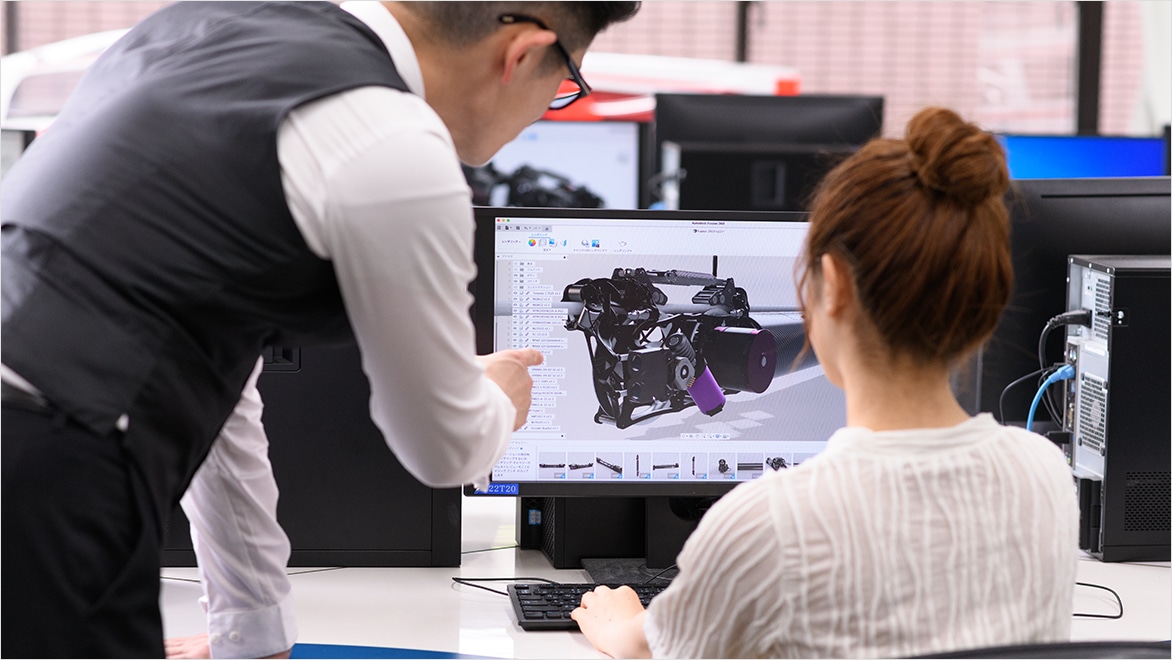 Educator and student at CNC machine