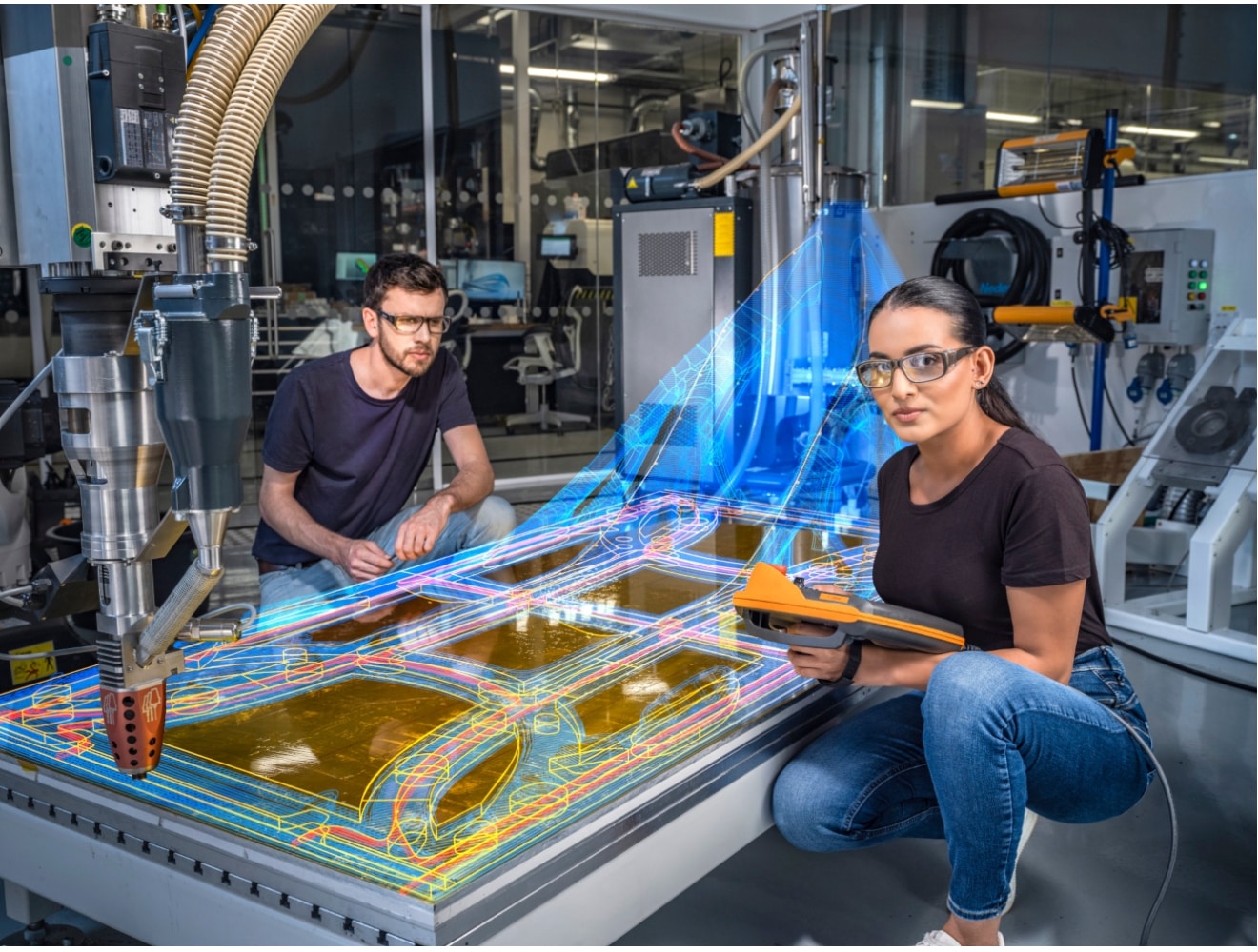 two students working on a manufacturing project