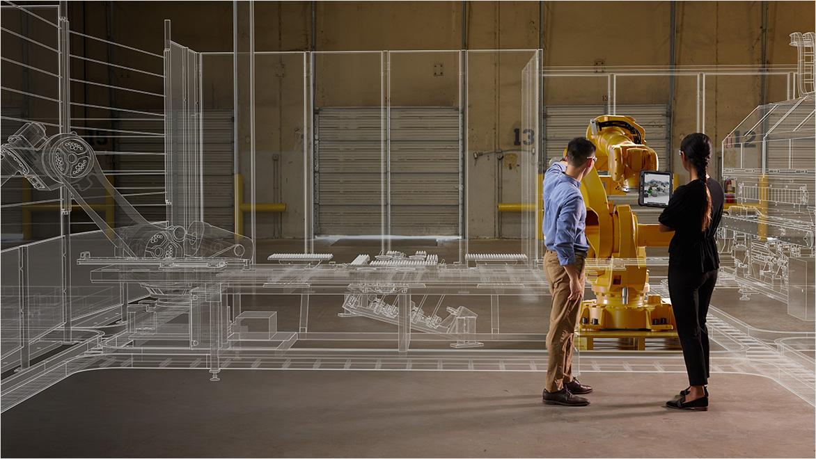 production engineers examining factory equipment