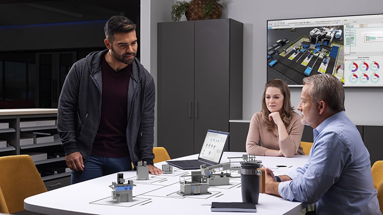 Production engineers discussing factory process in conference room