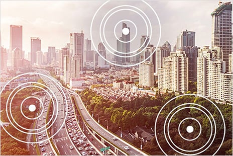 Highway leading to city with sky scrapers