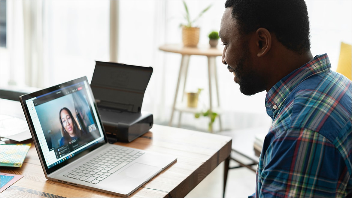 Person sitting at their desk on a video conference call