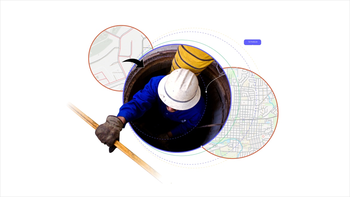 a man in a white hard hat descends into a sewer