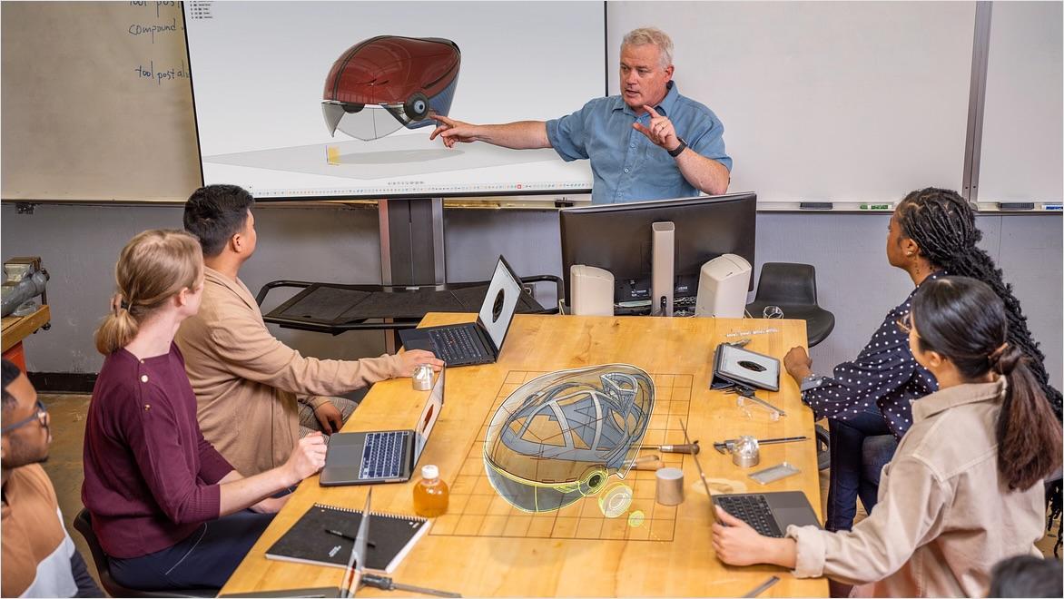 An instructor works with students at Diablo Valley College on Fusion designs.