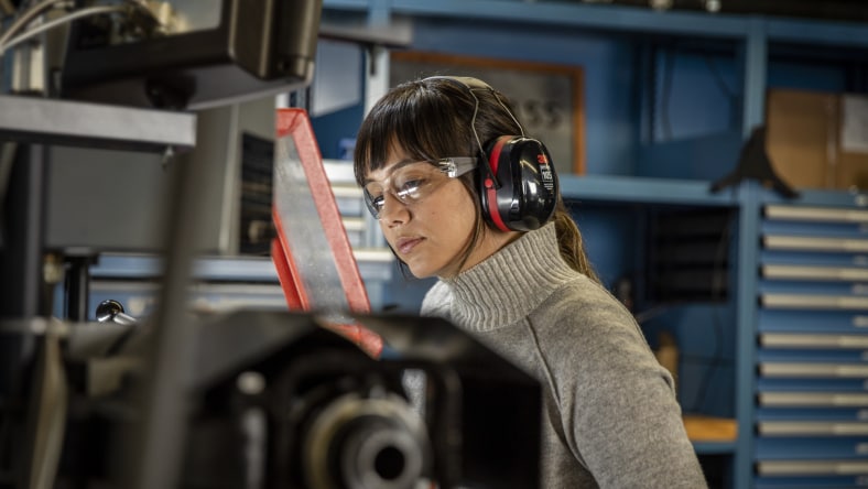 Image showcasing a worker on the manufacturing floor exhibiting Fusion Operations waste reduction.