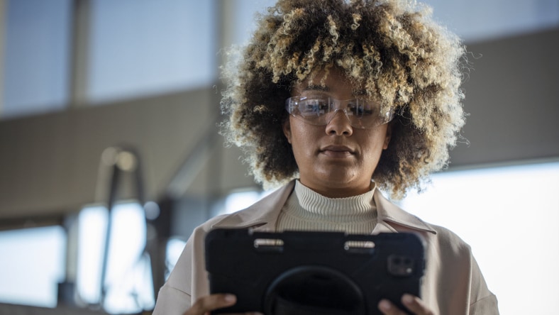 Image showcasing a worker on the tablet demonstrating Fusion Operations document control.