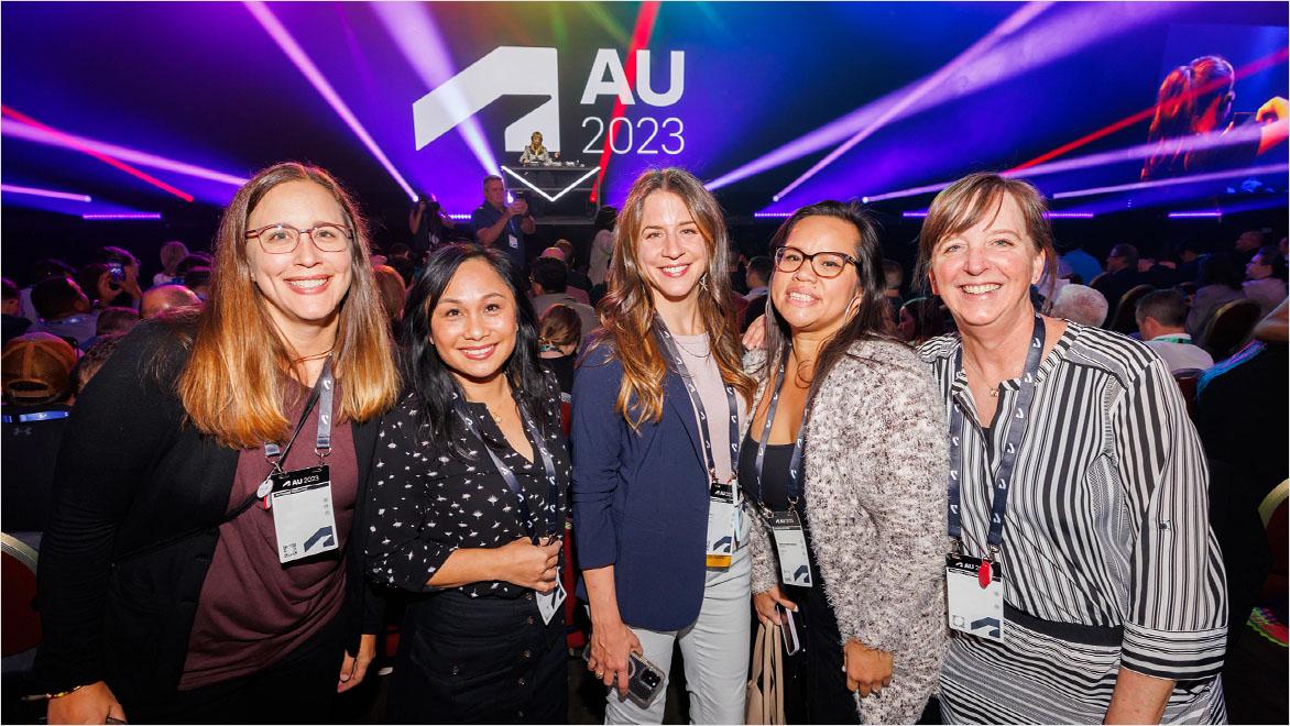 A multicultural group of five women attend an Autodesk University event in 2023