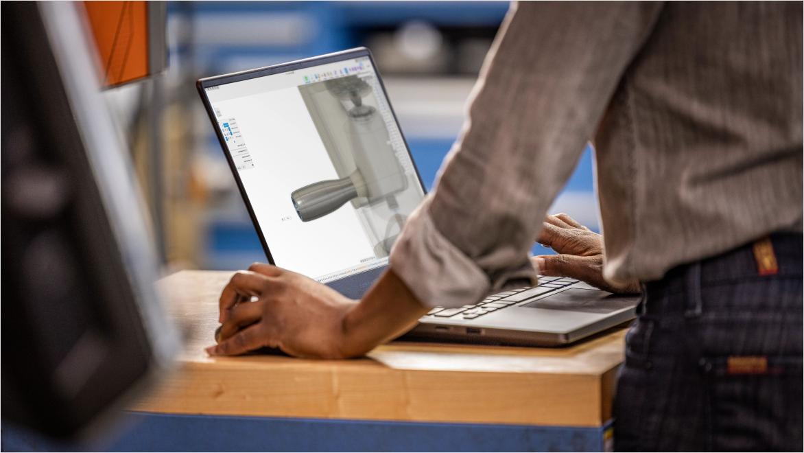 Autodesk Fusion software being used on a laptop
